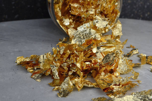 istock gold leaf for nails is scattered on the table 1650241313