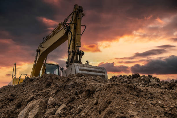 istock Excavator at a construction site at the end of the day 1650287678