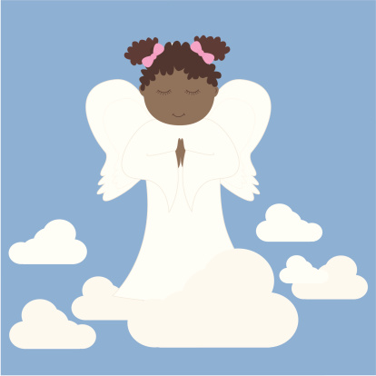 A cute little girl angel praying.