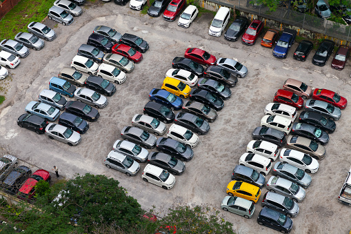 Kuala Lumpur, Malaysia - November 28, 2019: Parking lot aerial view, cars stand in rows