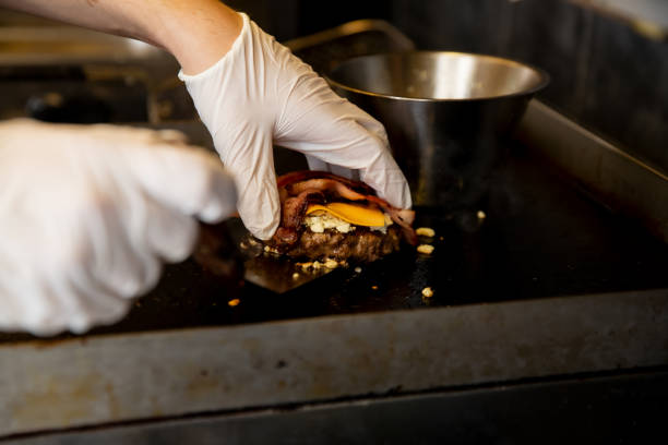 istock Chef cooking hamburgers 1650301442