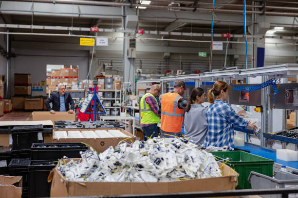 istock Manuel workers team work on production line with screw tool at factory 1650306830
