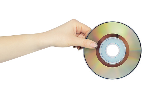 compact discs in hand isolated from background, concept to pass or throw away