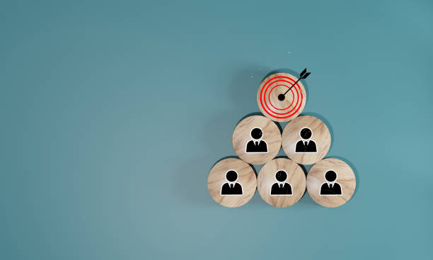 istock Red dartboard and black arrow with human icon for customer focus target group and customer relation management concept. 1650325866
