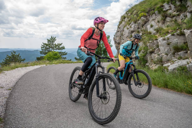 istock Smiling friends riding bicycle 1650330702