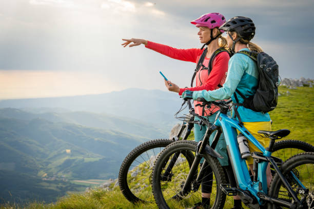 istock Mature women talking on mountain top 1650330760
