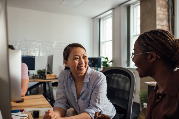 istock Assisting Colleague in the Office 1650344724
