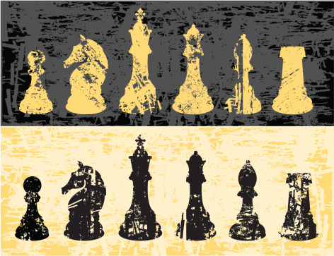 Dark and bright chessmen with grunge effect applied. The grunge effect has been cut directly into the shapes. 