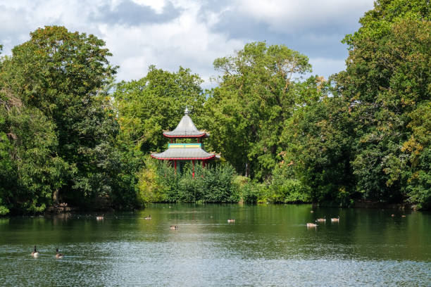 Victoria Park, Hackney, London, England - 29th July 2023: The Chinese Pagoda, originally built in 1842 at Hyde Park, now sits on West Lake at Victoria Park in Hackney, East London
