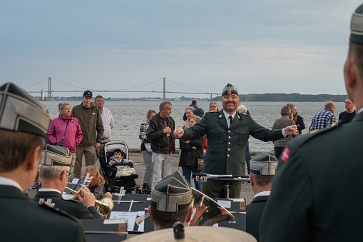 August 30, 2023, Fredericia, Denmark, military orchestra playing under the lead of  a conductor in connection with the Queen's visit to Fredericia