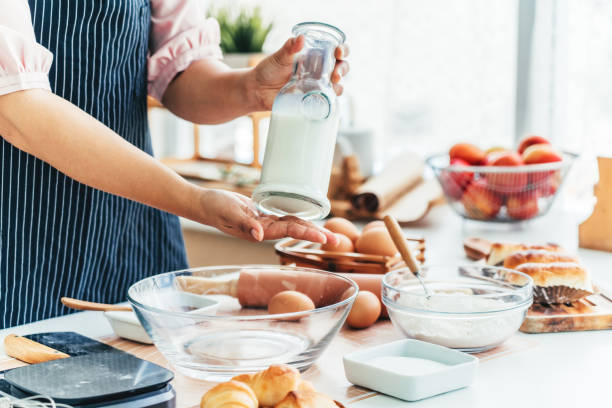 istock Female pastry chef holding milk with hands 1650421597