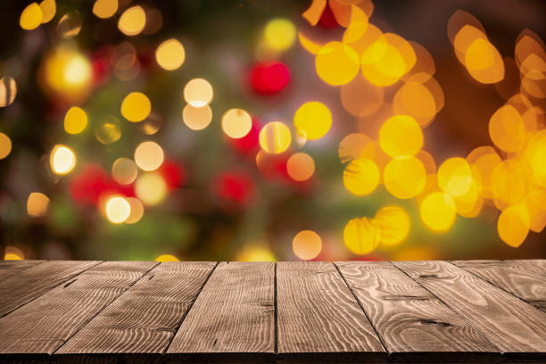 istock Empty wooden table with defocused Christmas lights background 1650426474