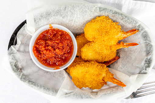 Close-up of kataifi-style breaded prawns.