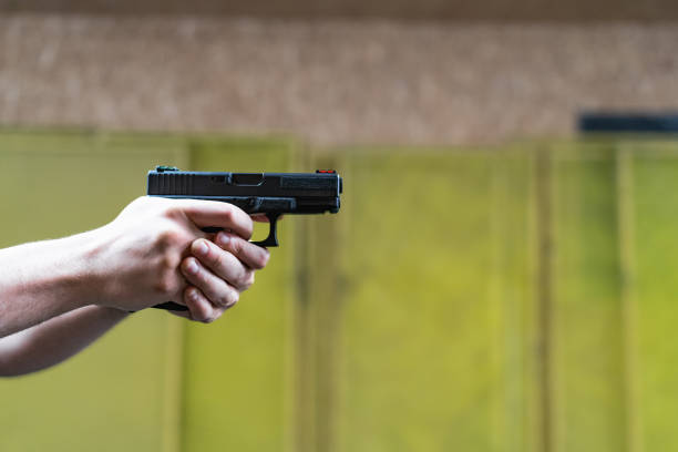 istock Shooting from a pistol in a shooting range, close-up photo. 1650428053