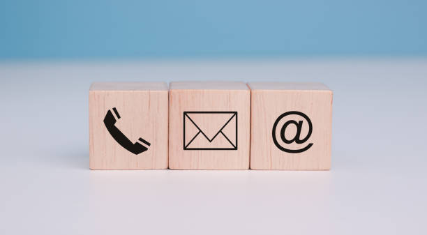 istock Customer support hotline Contact us people connection. cube wood with the email, call phone, address, and Chat message icons. Website page contacts us or e-mail marketing concept, copy space. 1650436763