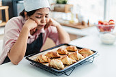 Female pastry chef feeling failure making bread