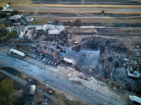 Aerial view of burning industrial distribution warehouse.