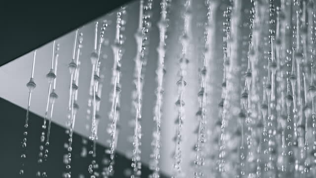 SLO MO LD Water starting to run from a rain shower head