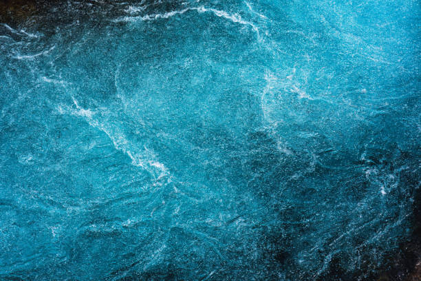 Crystal blue water with air bubbles flowing motion