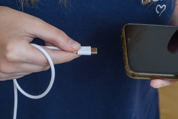 istock Connect the mobile phone to the charger 1650505304