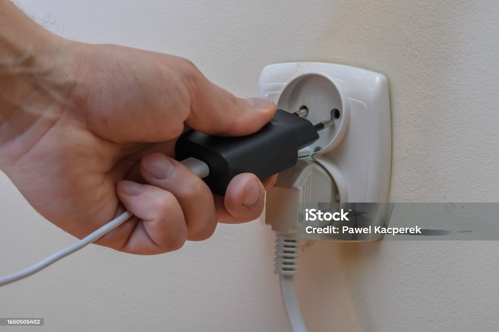 Plug The Socket Insert The Plug Into The Electrical Socket Stock Photo - Download Image ...