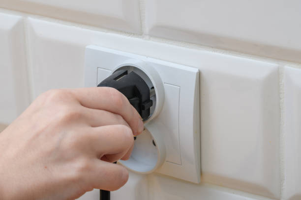 istock The plug of the power supply plugs into a wall socket 1650505803