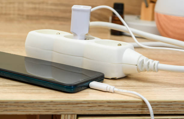 istock The phone is plugged into the wall socket at home 1650505962