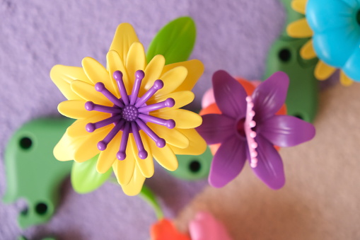 Colorful flower garden toys and planting tools. Garden themed toys for kids. Pretend play, Montessori activity