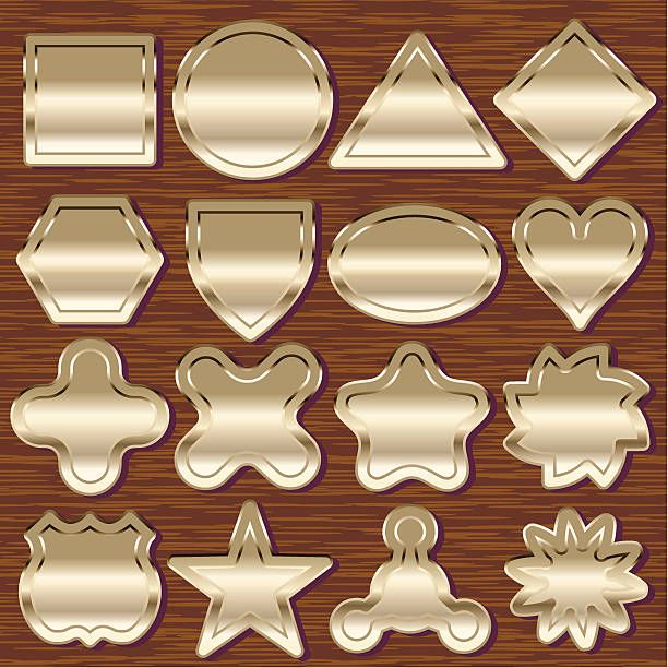 шестнадцать латунь эмблемами on wood - nomura stock illustrations