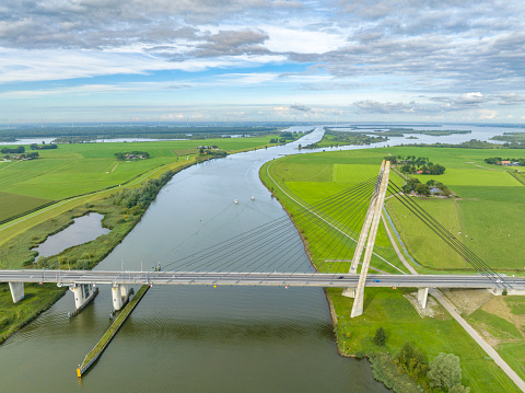 Overhead drone view on the Eilandbrug over the river IJssel with the N50 highway. The bridge is located near Kampen in Overijssel, The Netherlands.