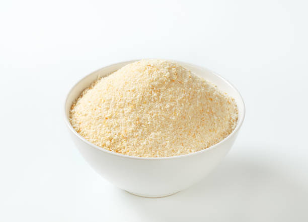 white ceramic bowl of fresh breadcrumbs on a white background