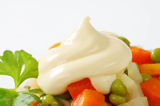 Salat from vegetable mix with mayonnaise in a bowl