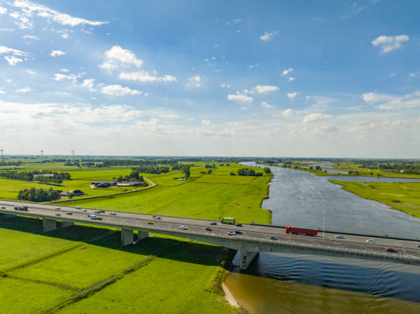 istock Highway over a bridge crossing a river seen from above 1650513079