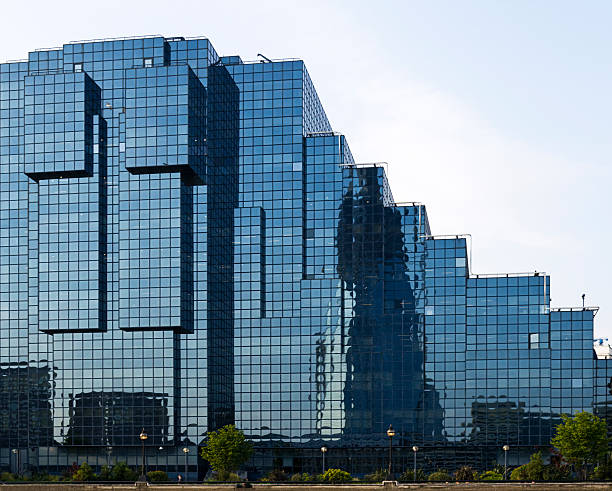 istock Large modern building with reflective glass windows. 165051367