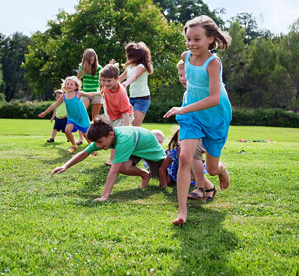 istock Children running in a park 165051657