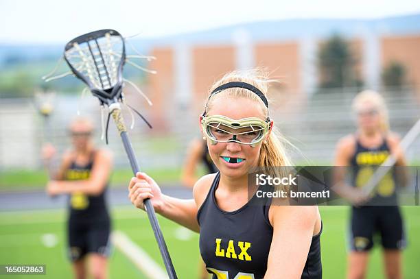Intense Look From Female Lacrosse Player Stock Photo - Download Image Now - Mouthguard, Sport, Lacrosse