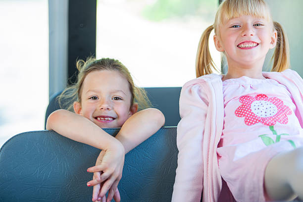 istock Friends Riding  School Bus 165053360