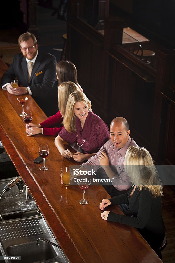 People Enjoying Drinks At Nightclub Bar Group Of People With Drinks At Nightclub Bar Bar Counter Stock Photo