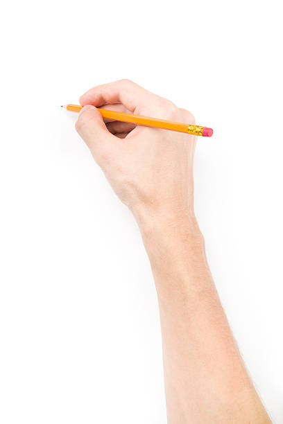 Hand with pencil writing something stock photo