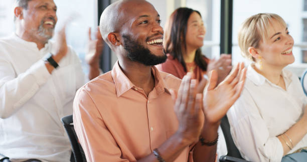 applause, crowd and seminar with a business team clapping during a convention or training in the workplace. conference, presentation and speech with a man and woman employee audience applauding - training business seminar clapping imagens e fotografias de stock