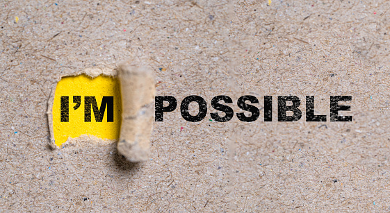 Yellow torn paper with I'm possible  wording , Positive thinking mindset and human inspiration development concept.