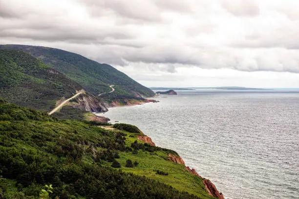 Photo of The world famous Cabot Trail on the Altantic Ocean on a foggy day.