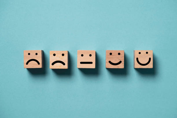 istock Human face from sad to smile  print screen on wooden block cube face on blue background for positive thinking and excellent evaluation rating after use product and service concept. 1650593821