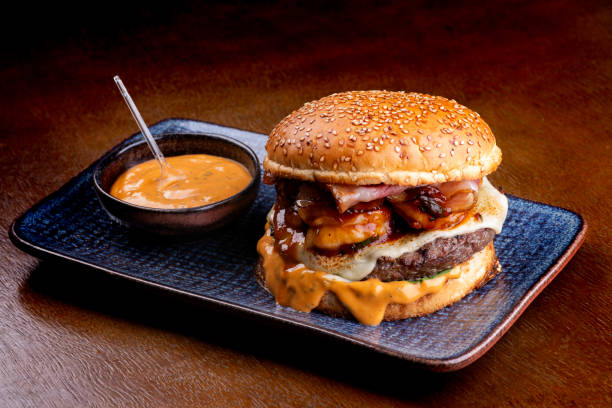 istock surf and turf burger with melted beef cheddar burger shrimp with cheddar sauce 1650603062
