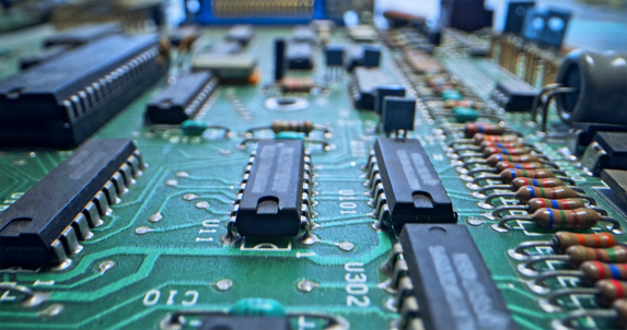 Close-up of green motherboard at recycling centre.