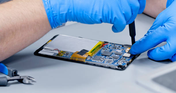 istock Repairman repairing digital tablet 1650609202