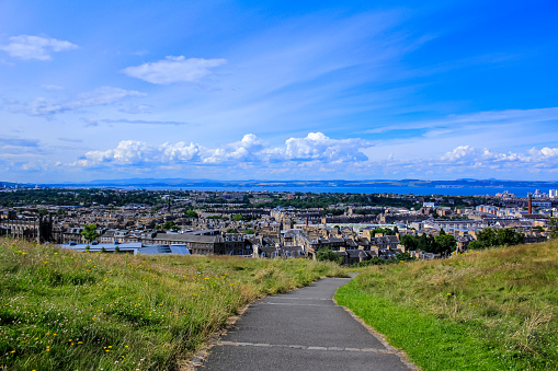 Edinburgh, Scotland - Jan 17, 2024 - Amazing Edinburgh Cityscape and Edinburgh Castle seen from the top of Salisbury Crags. Destinations in Europe, Copy space, Selective focus.