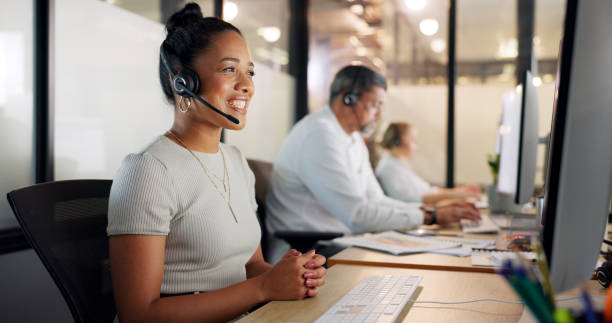 Contact us, telemarketing and crm, black woman in customer service with headset and smile on face. Happy to help, call center agent or sales consultant on phone call, support and consulting online. Contact us, telemarketing and crm, black woman in customer service with headset and smile on face. Happy to help, call center agent or sales consultant on phone call, support and consulting online. switchboard operator stock pictures, royalty-free photos & images