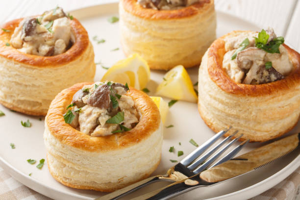 сhicken mushrooms vol au vent closeup on the plate on the wooden table. horizontal - vol au vent imagens e fotografias de stock