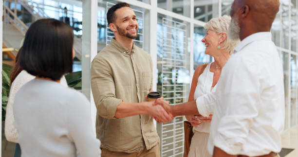 istock Diversity, team and men handshake, welcome and partnership for collaboration, group project and modern office. Teamwork, business people and hand gesture for greeting, thank you and conversation. 1650652376